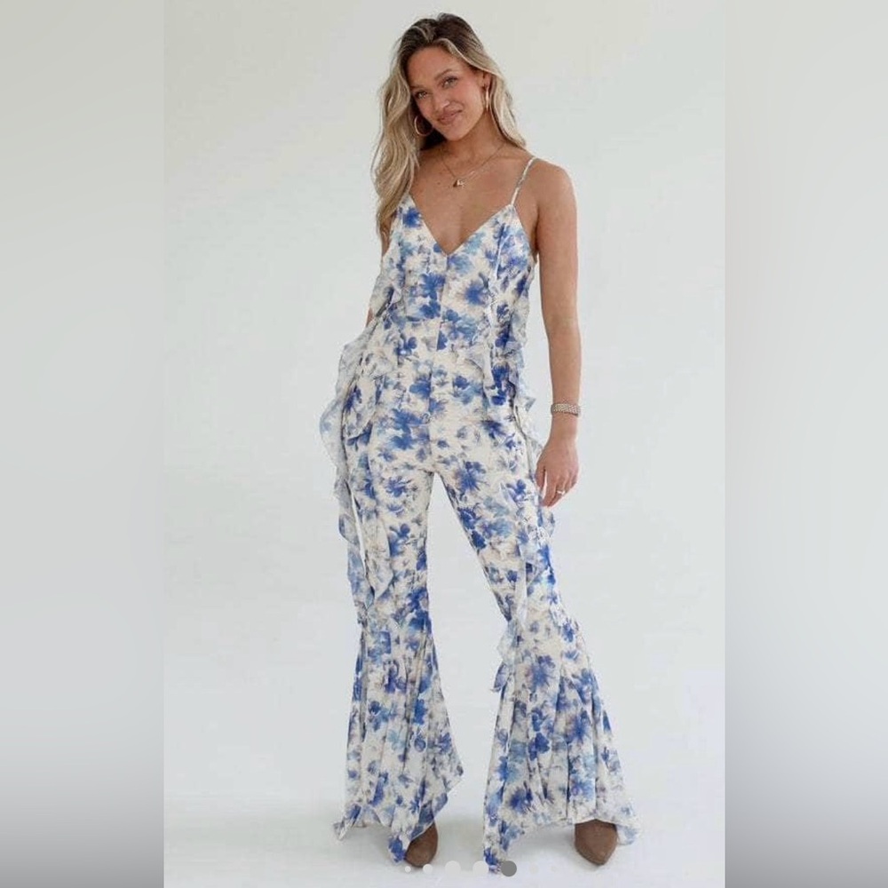 Super fun and flirty floral frilly jumpsuit by Lane 201.